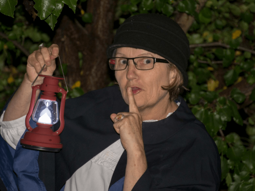 Hahndorf After Dark Walking Tour Image 3 Sharon whispering to the audience holding a lantern