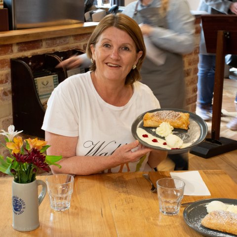 Sharon displaying a Struddel she made