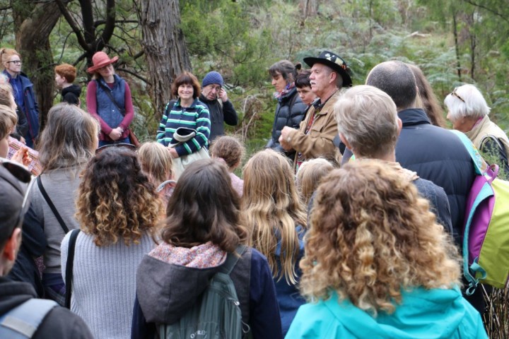 a group of people standing in front of a crowd