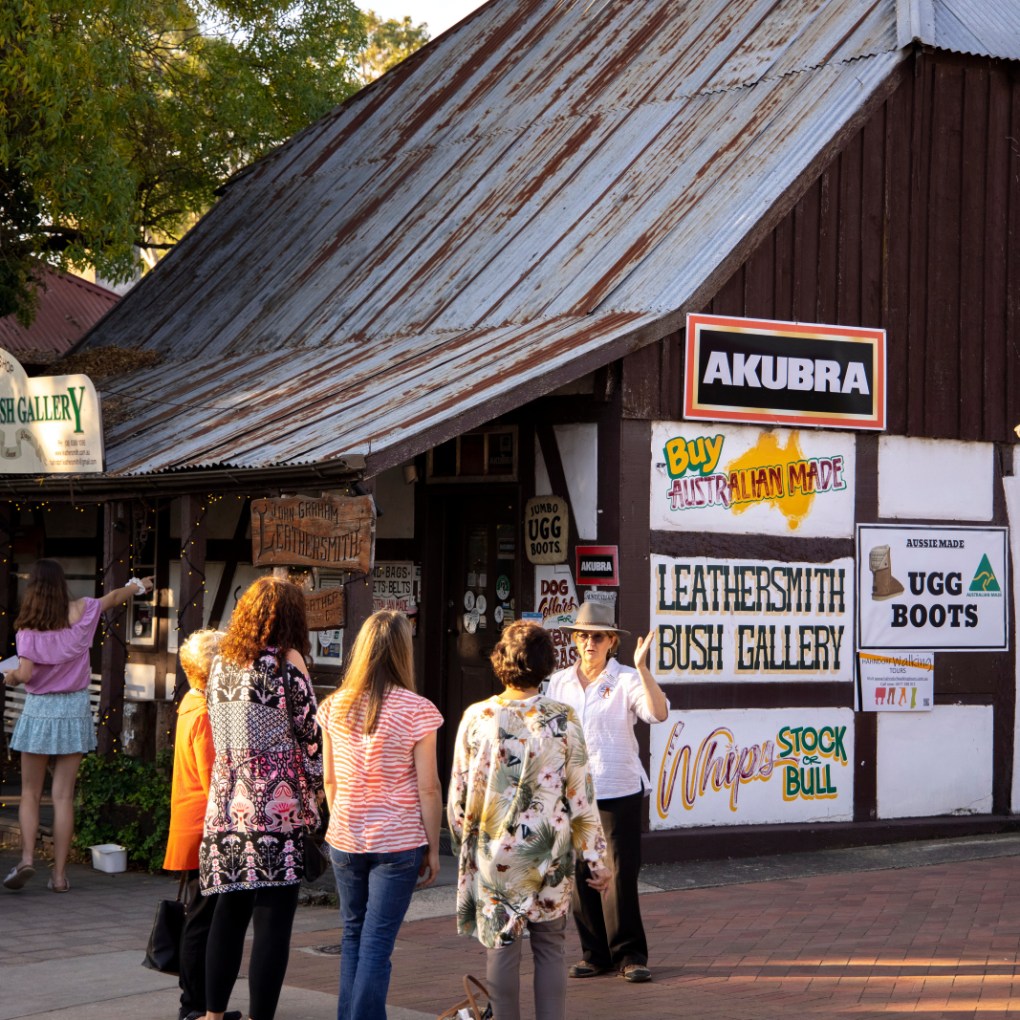 a group of people standing in front of a building