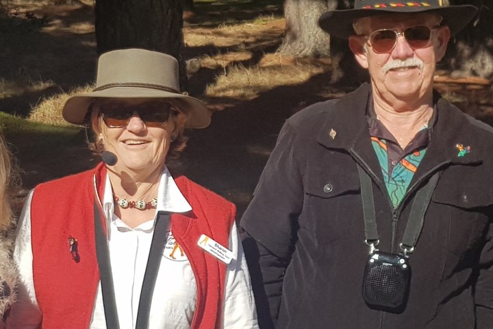 a person wearing a hat posing for the camera