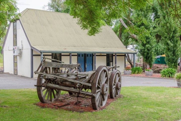 a wooden bench sitting in the grass