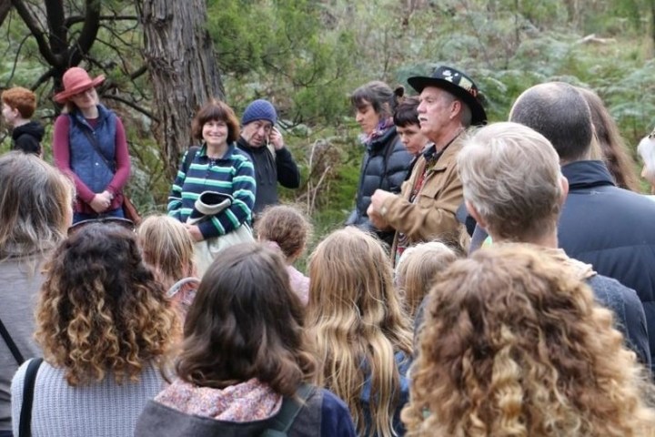 a group of people standing in front of a crowd