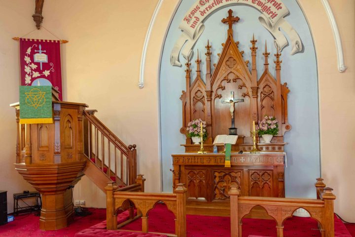 a dining room table in front of a mirror posing for the camera