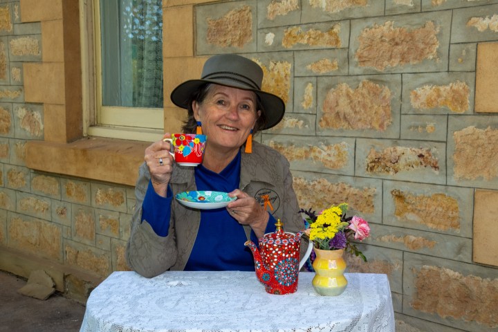 a woman holding a baby